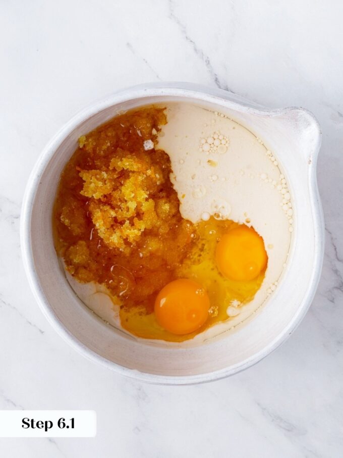 Warm coconut oil joins the macerated sugar here, carrying citrus oils through the whole orange bread.