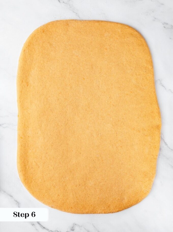 An eighteen by thirteen inch rectangle gives sweet potato cinnamon rolls enough length for twelve swirls.