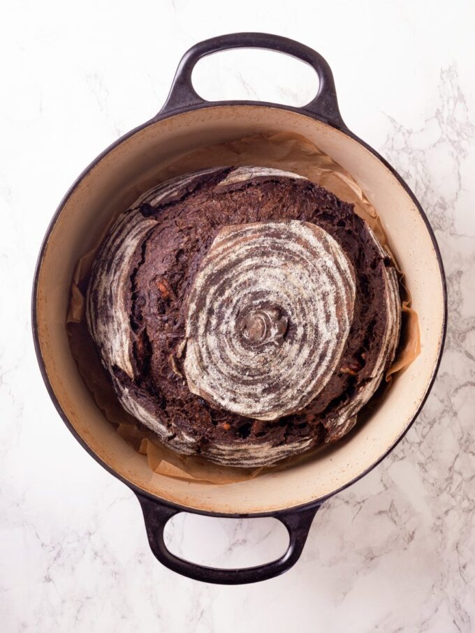 Baked inside the Dutch oven, chocolate sourdough bread's crackly crust forms in the high trapped heat.