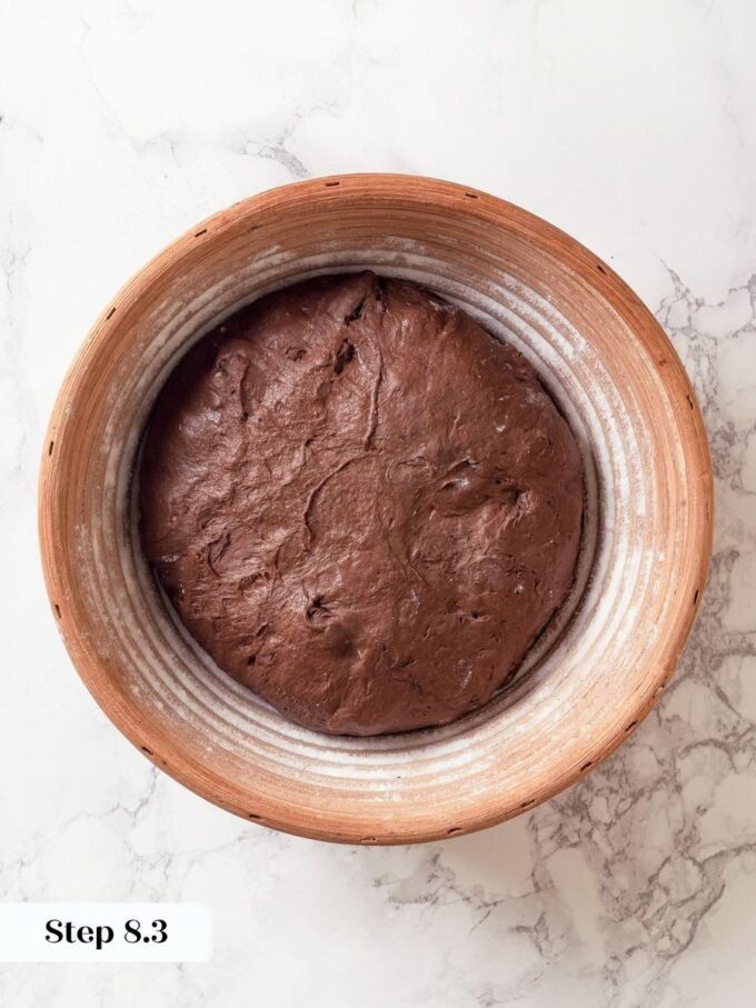 Transferring to the banneton molds the spiral pattern that crowns the finished chocolate sourdough bread loaf.