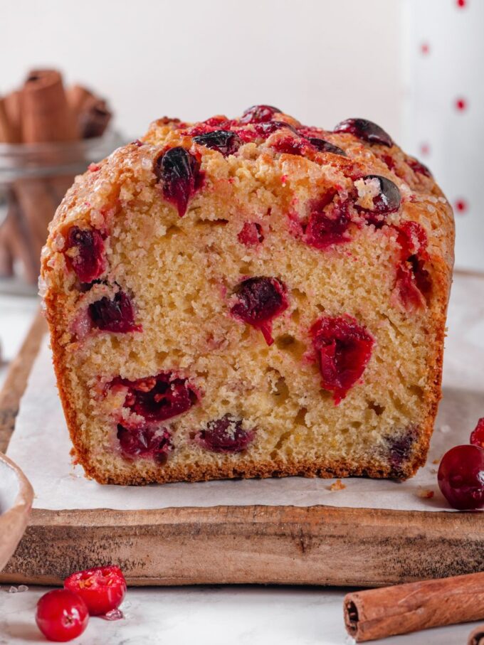 Straight on, the cross-section proves the berries stayed suspended rather than sinking in the cranberry bread.