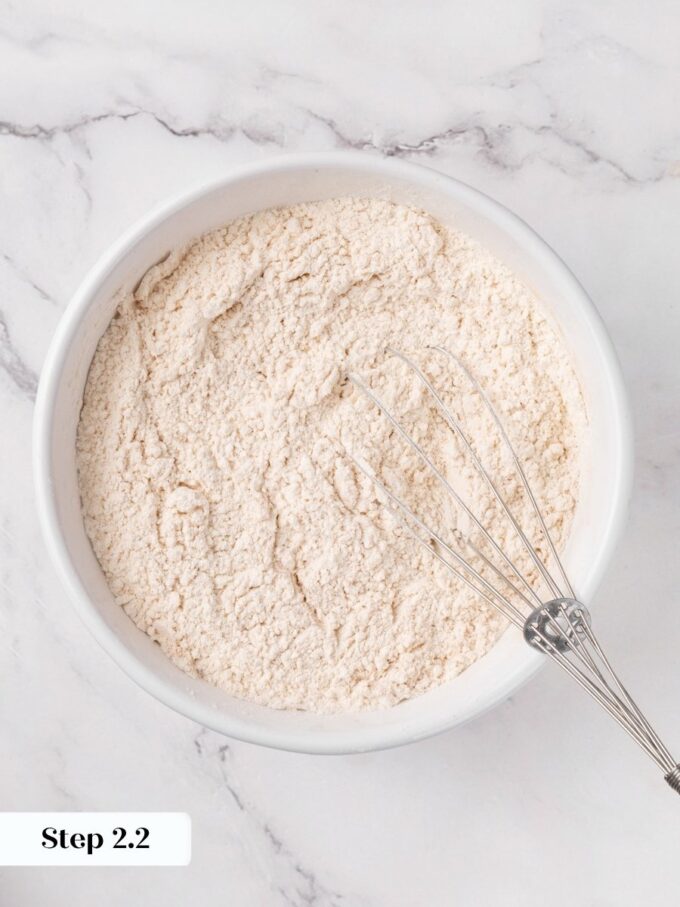 Whisking until uniform keeps the cranberry bread crumb from developing pockets of concentrated leavening.