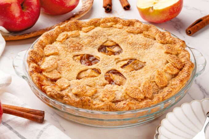 Golden and fully baked, homemade apple pie makes a welcoming centerpiece for fall gatherings.