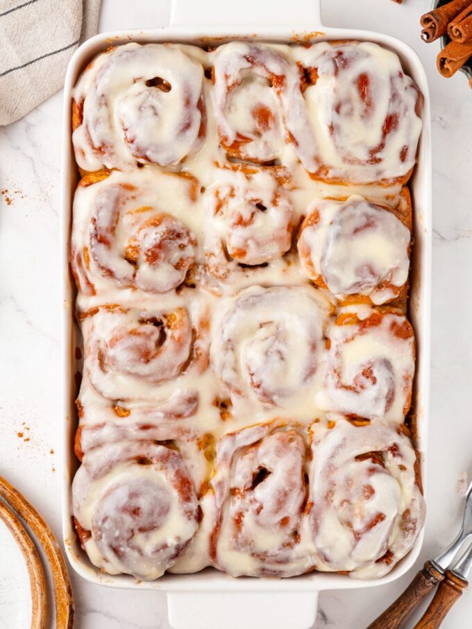 This whole-pan view is how pumpkin cinnamon rolls arrive at the table, still warm and glossy.