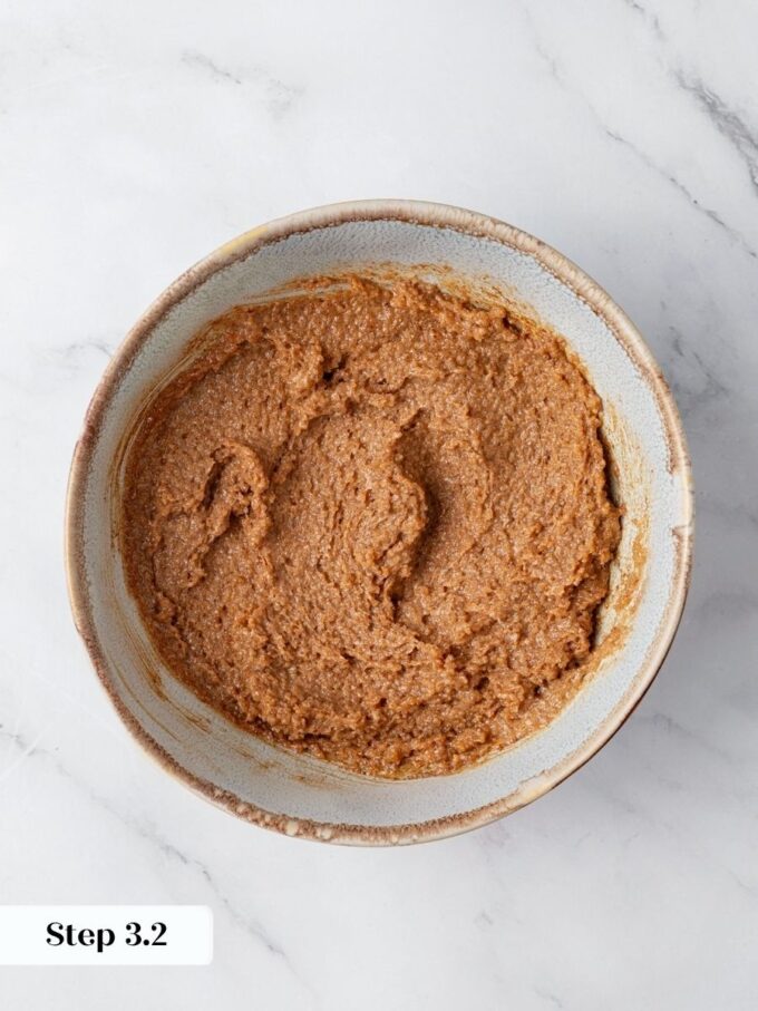 Working the filling to a frosting-like paste keeps pumpkin cinnamon rolls from leaking sugar while baking.