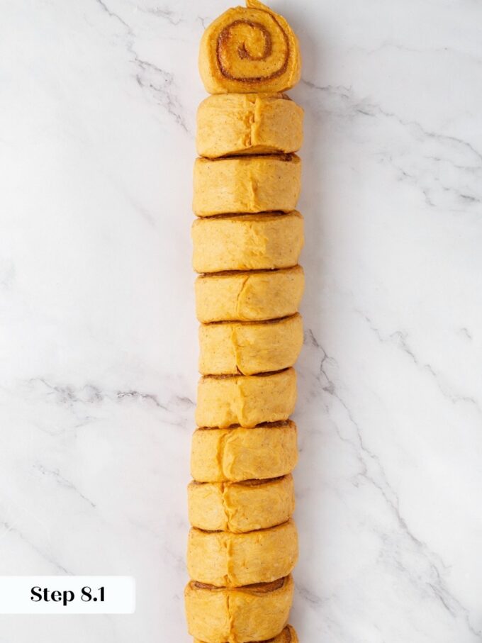 Equal slices keep pumpkin cinnamon rolls baking at the same rate right across the pan.