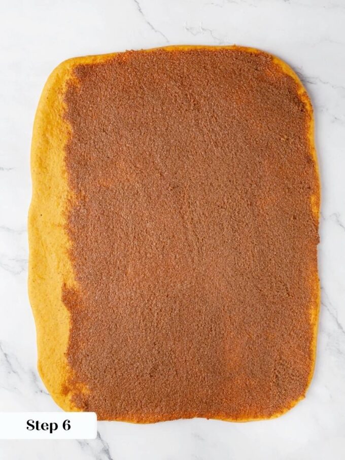 Leaving a clean border lets the last turn seal, so pumpkin cinnamon rolls hold together.