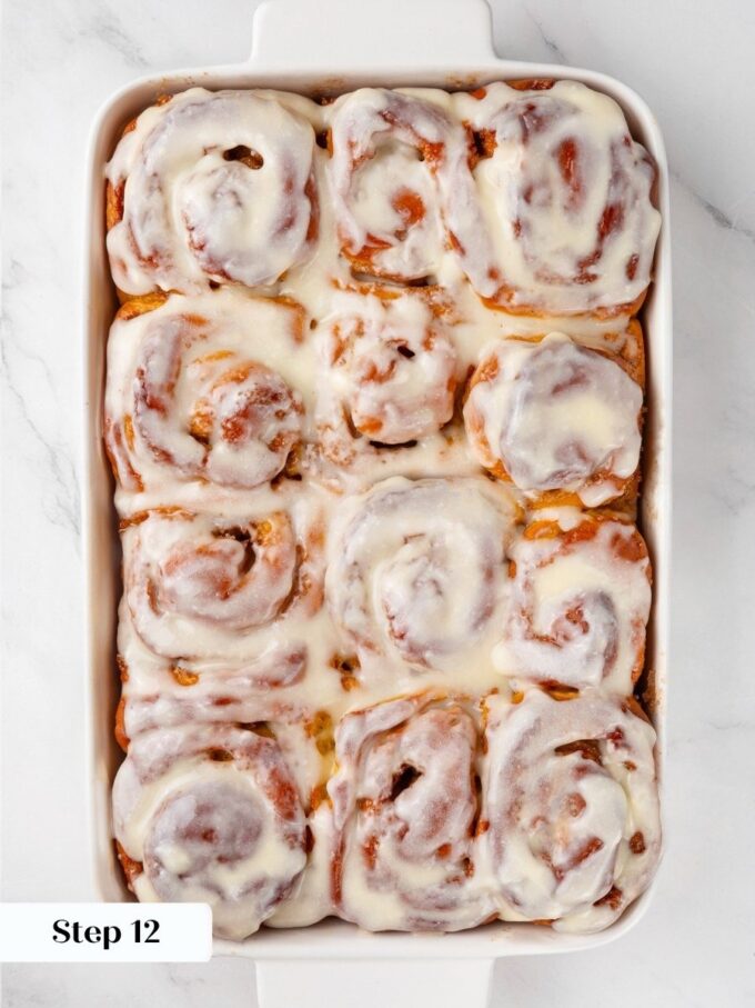Frosting spread on barely warm pumpkin cinnamon rolls settles into a soft layer instead of melting.