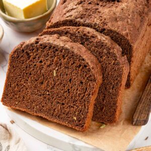 Thick Russian black bread slices hold their shape for Reubens or ham and Swiss.