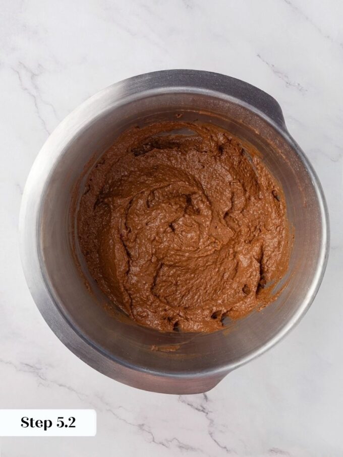 After three minutes of mixing, the Russian black bread dough turns cohesive and richly dark brown.