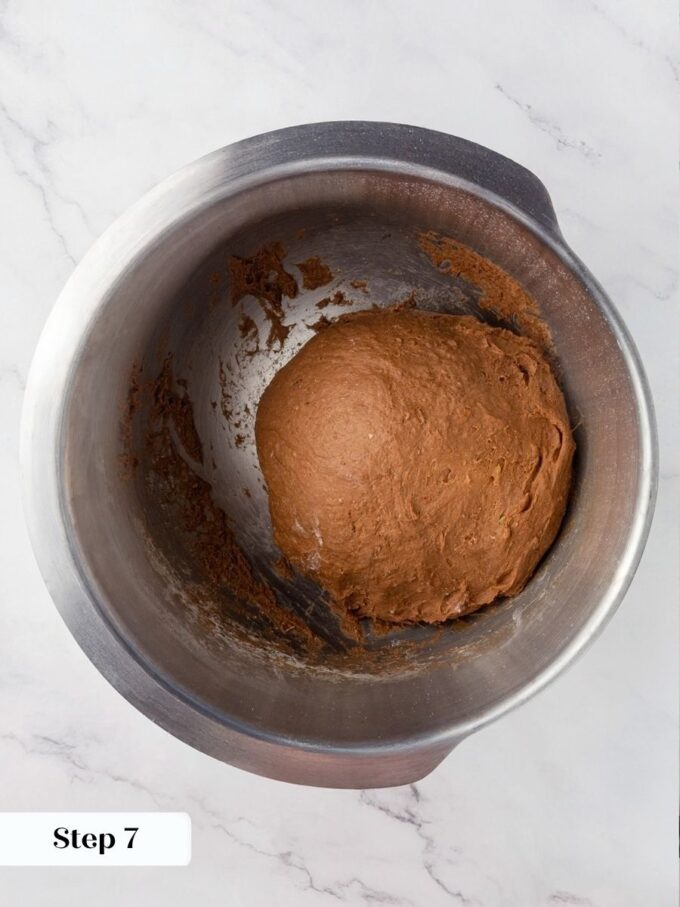 Well-kneaded Russian black bread dough feels smooth, slightly tacky, and holds its shape when pulled.