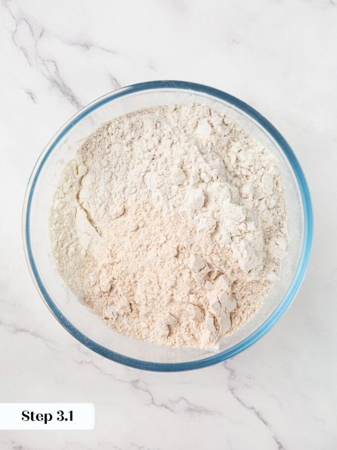 Three flours go into one bowl so the Russian black bread dough comes together cleanly later.