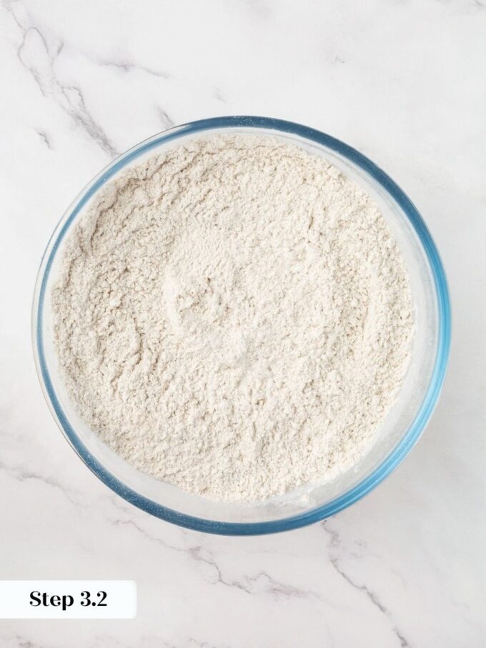 Whisking the rye and wheat flours together keeps the Russian black bread texture consistent throughout.