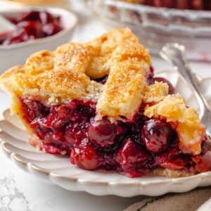Whole tart cherries stay suspended in glossy, set filling in every slice of sour cherry pie.
