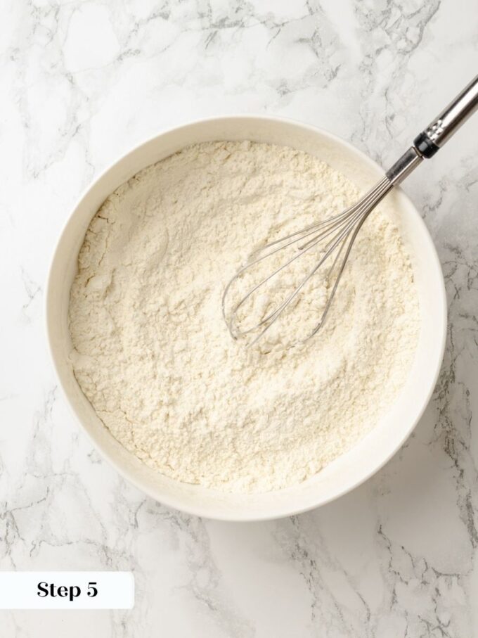 Keeping the dry ingredients cold protects the flaky layers in sour cherry pie crust.
