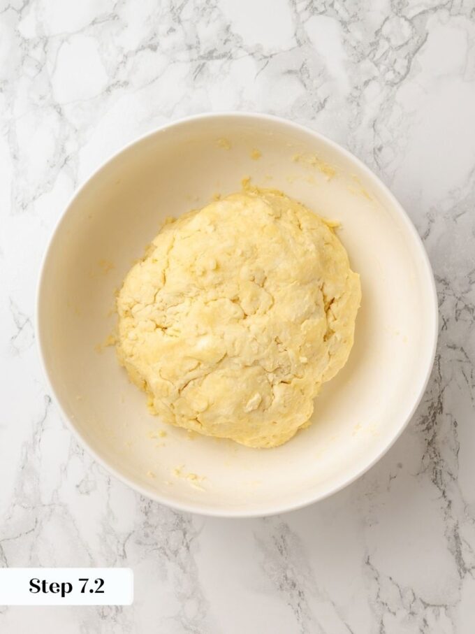 Mashing the dough against the bowl brings it together without overworking the sour cherry pie crust.